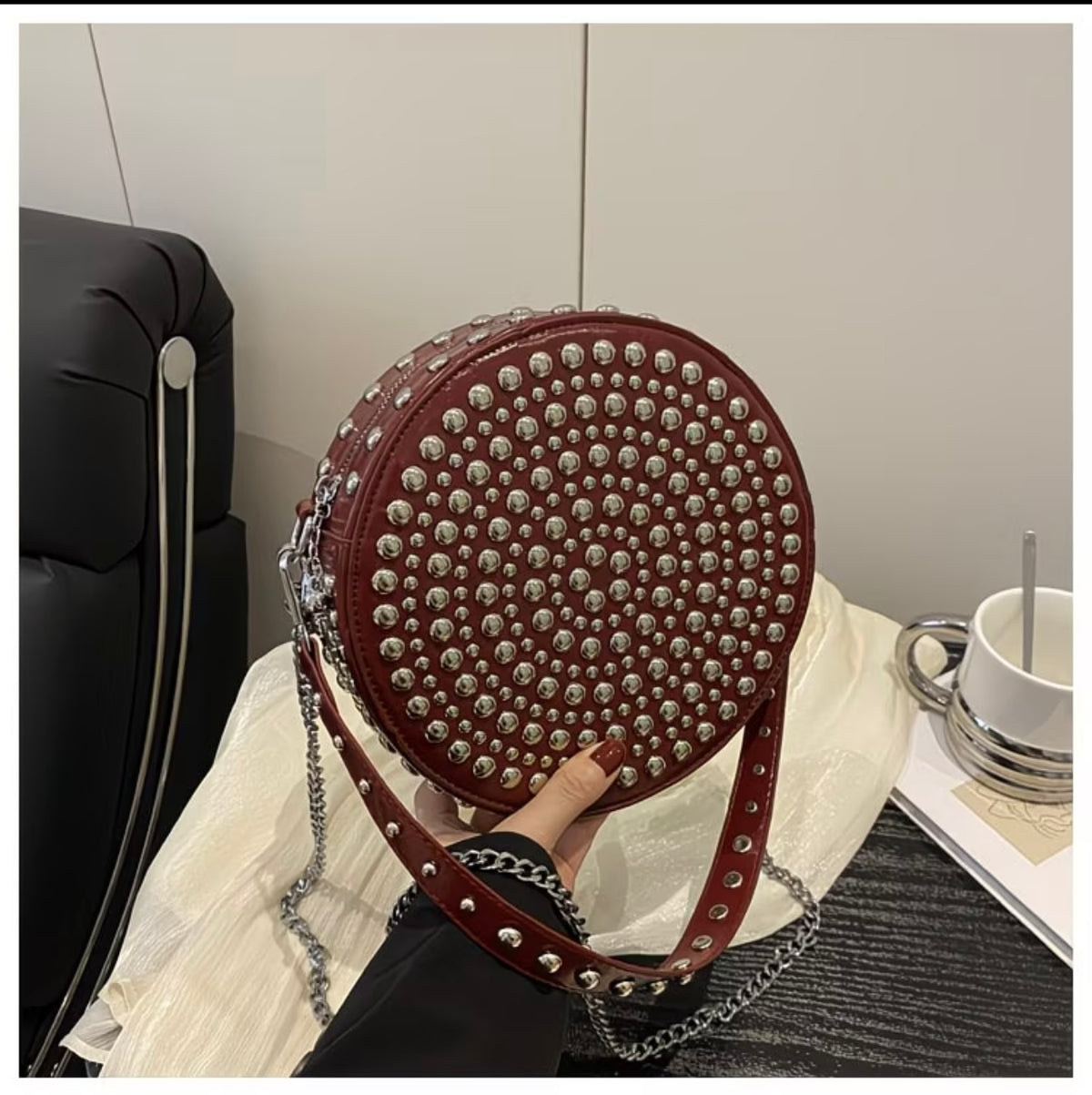 Vintage-style , crossbody shoulder bag with metal rivets, versatile chain-strap handbag